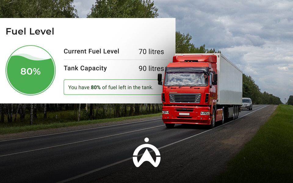 A red truck drives on a highway, displaying a fuel gauge indicating 80% fuel level with 70 litres filled in a 90-litre tank.