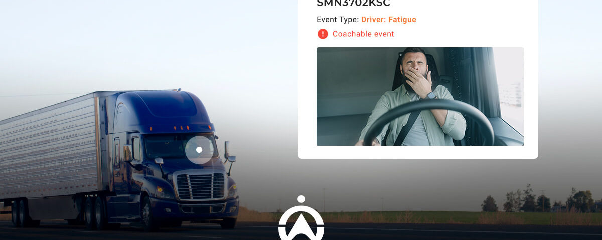 A blue semi-truck drives on an open road, with an overlay detailing driver fatigue as a coachable event.