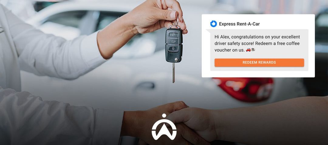 A person hands over car keys while the screen displays a message congratulating Alex on his driver safety score and offers a coffee voucher.