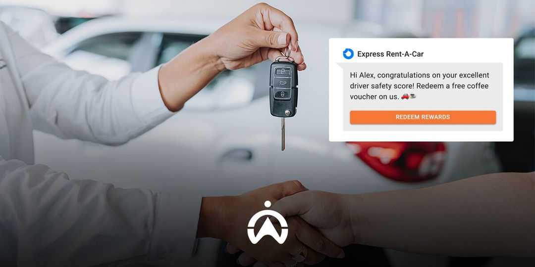A person hands over car keys while the screen displays a message congratulating Alex on his driver safety score and offers a coffee voucher.